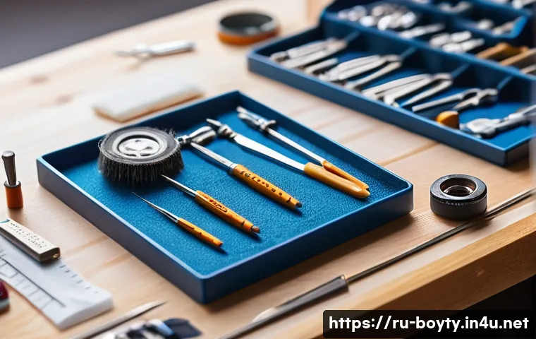 미니카 전용 도구 및 키트 - A close-up scene of a hobbyist’s workspace focused on miniature car assembly: several anti-static tw...